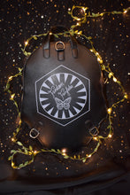 Load image into Gallery viewer, fandom fairytales logo on kylo helmet backpack reverse sidewith a star and moon background
