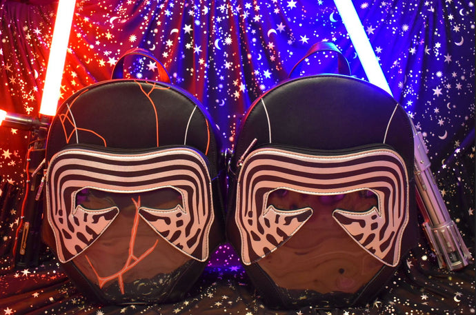 kylo helmet backpack with clear cut out window display and lightsabers with a star and moon background